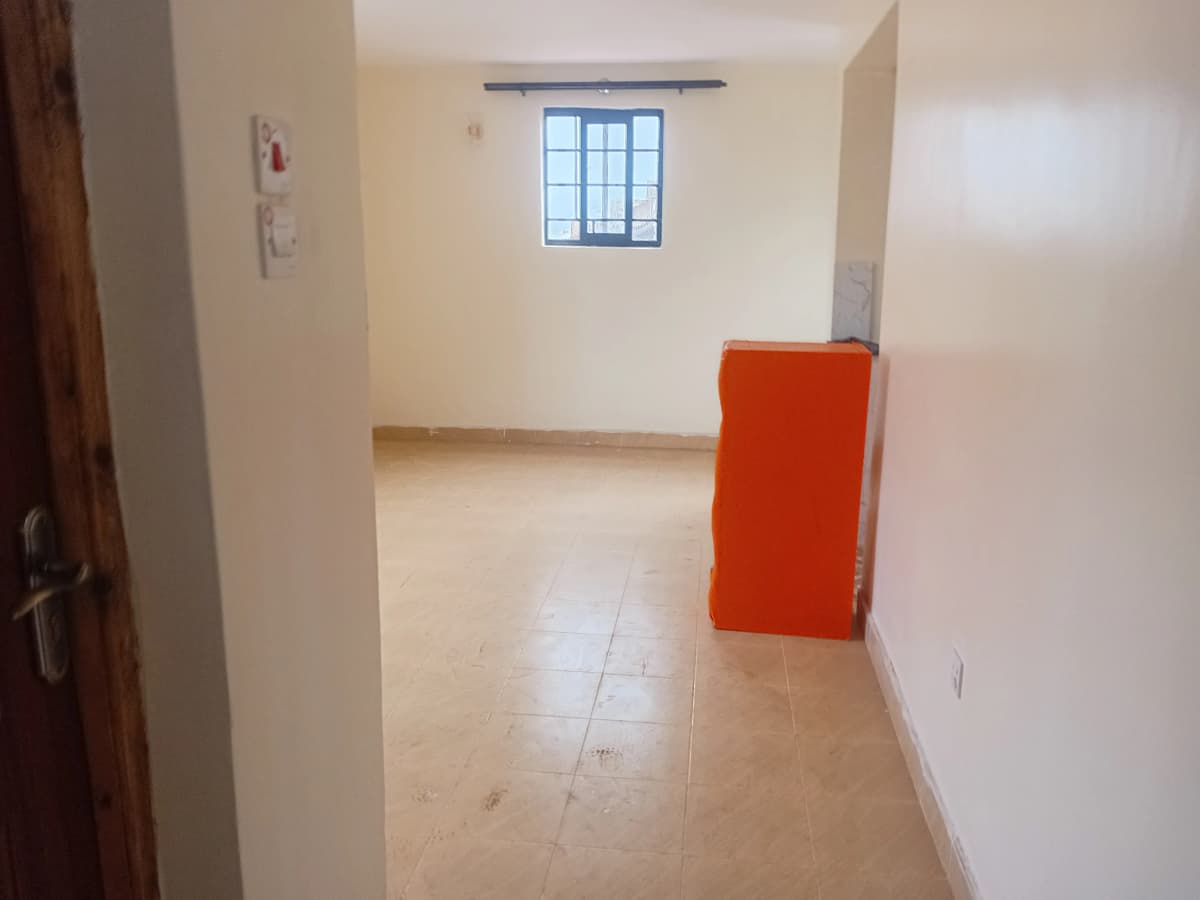 Bright corridor with tiled flooring and window access