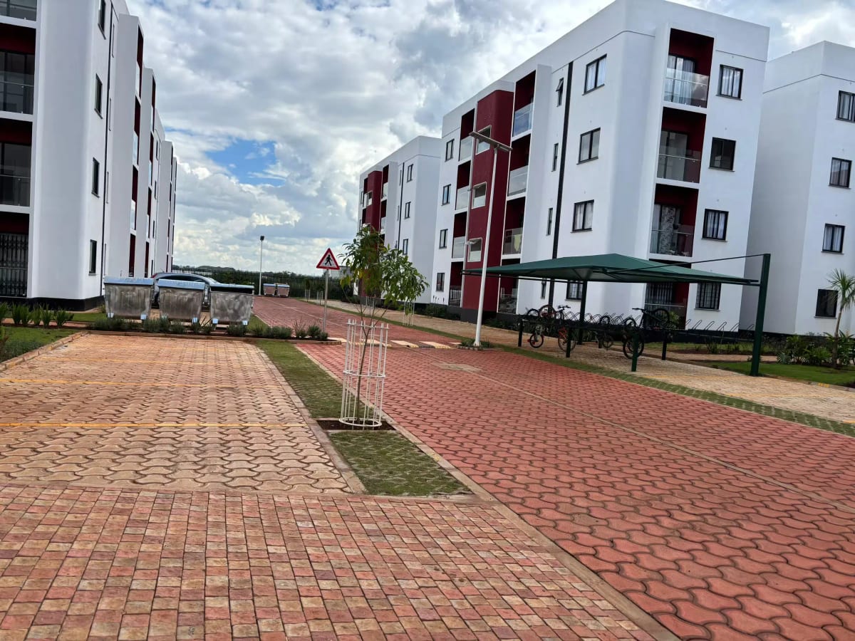 Modern residential complex with paved compound and landscaping